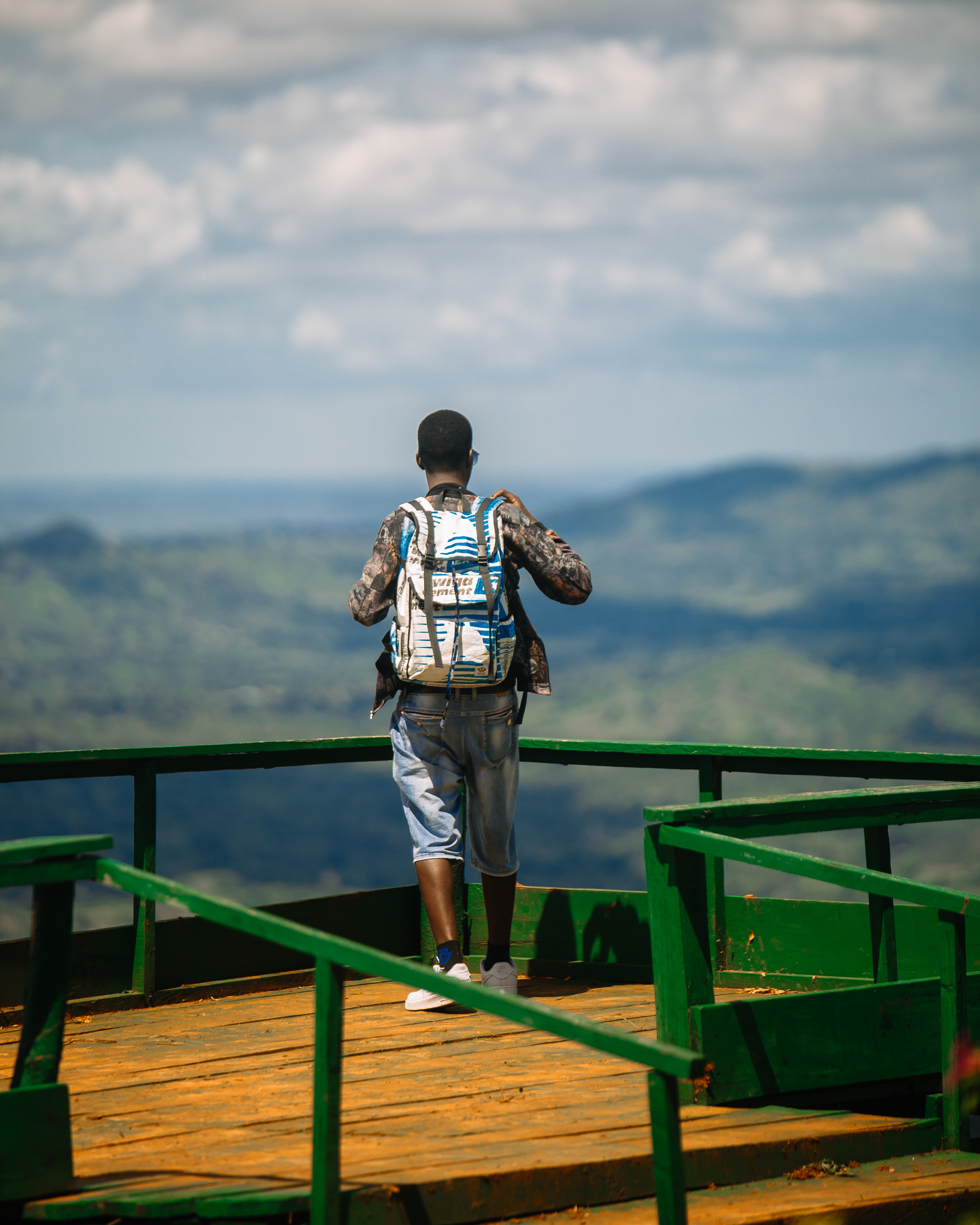Person standing wearing a Twiga bag
