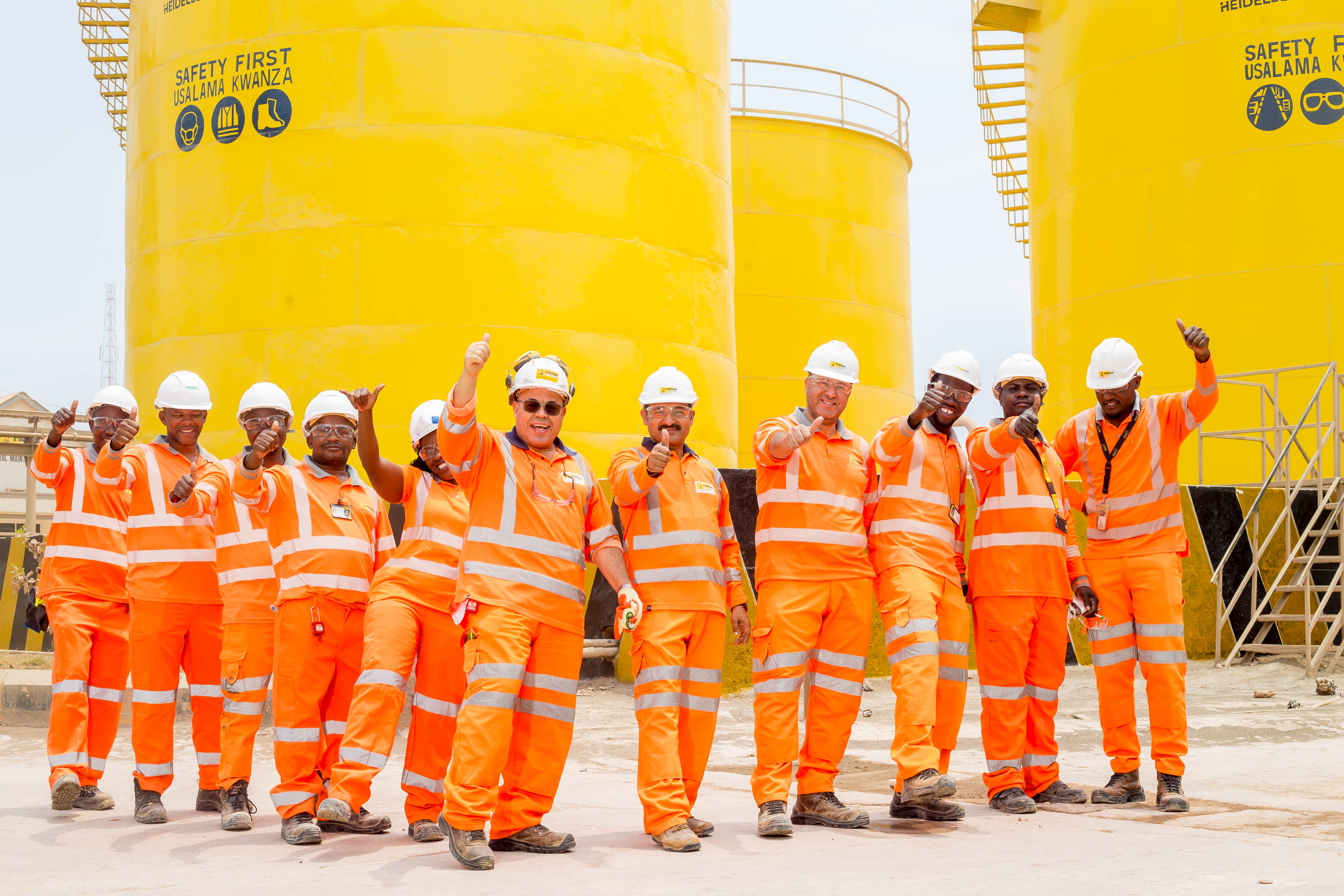 Group of people standing wearing PPE