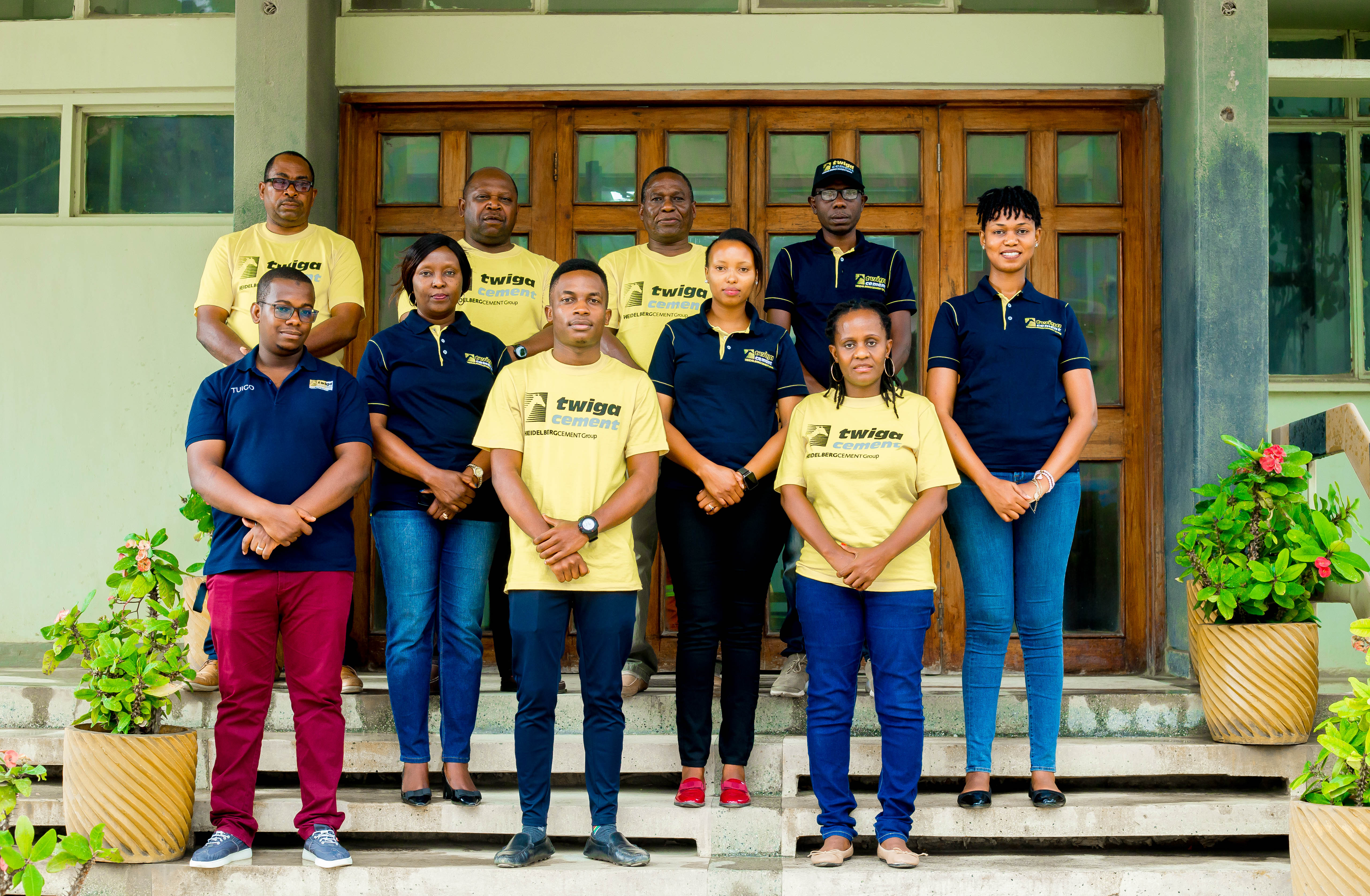 Group of employees standing in front of a building