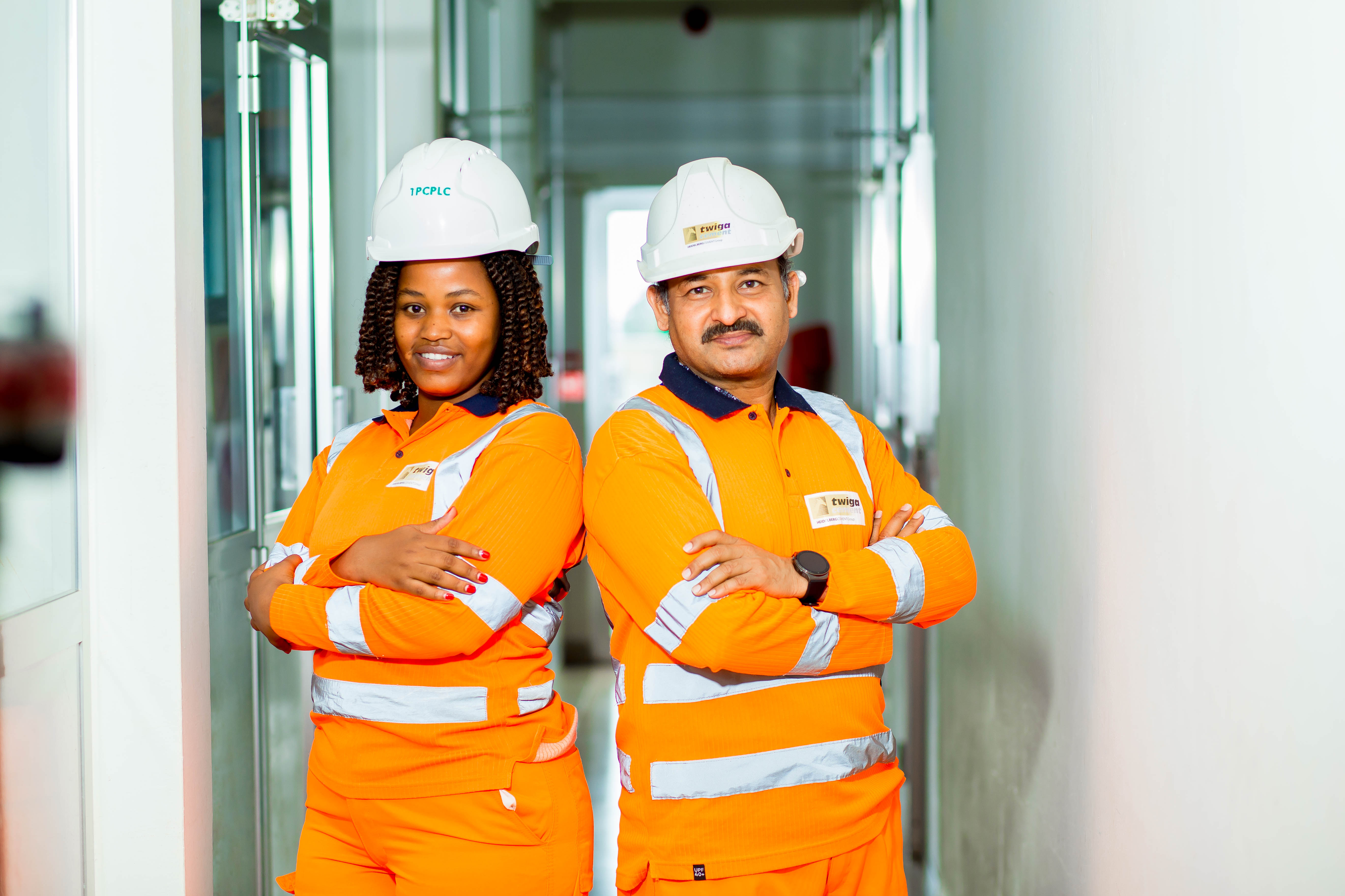 Two people in safety clothing in the office